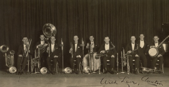 On front: "With love, Austin" On back, in Mama Helen's handwriting: "George Olson's band, 1920 New York. Austin F. Yoder 4th from the right, with saxophone. George Olson, in center.